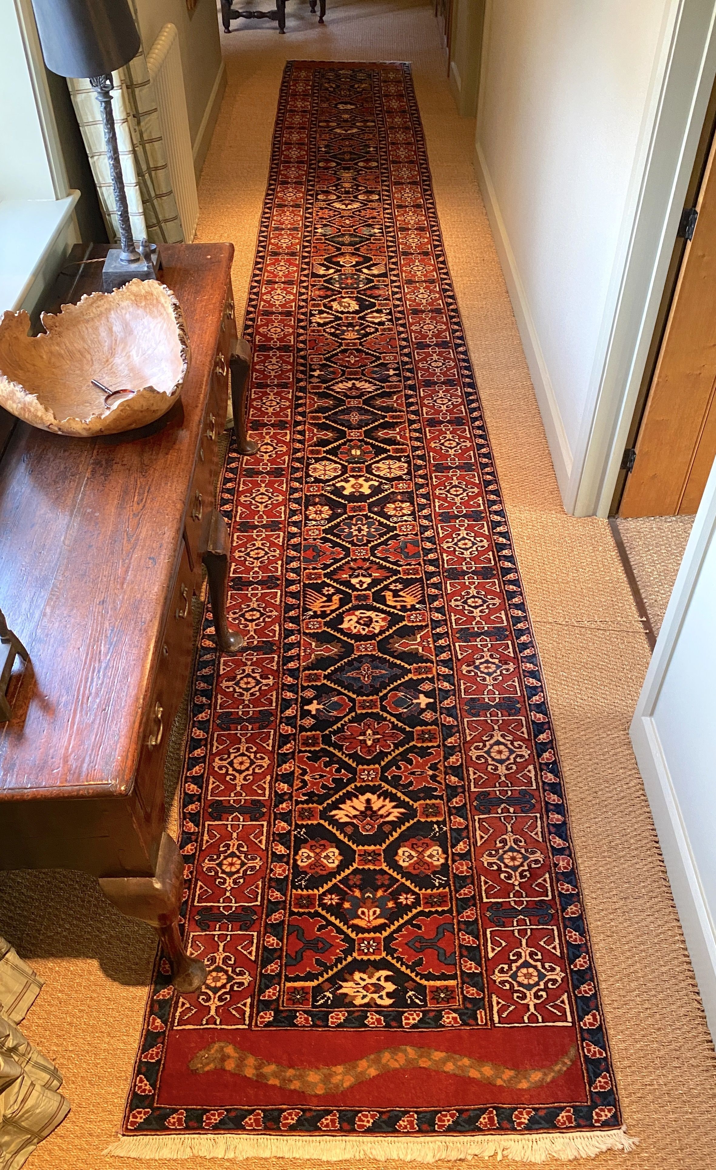 An unusually long Persian blue ground runner, with hexagon motifs, triple bordered, 6.8m x 89cm